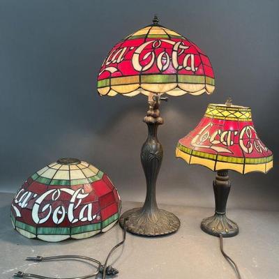 Lot 301 | 3 Coca-Cola Lampshades & 2 Lamps
