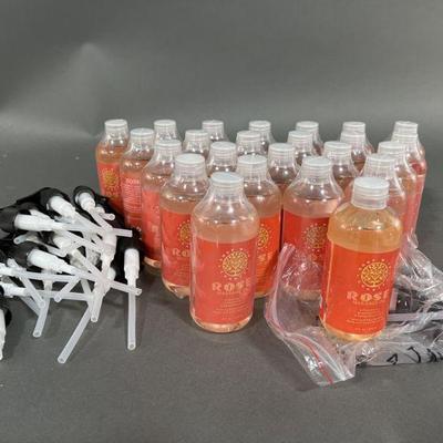 Lot 433 | 23 New & One Tested Rose Massage Oil Bottles
