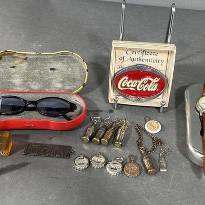Lot 308 | Coca-Cola Jewelry, Numbered Belt Buckle
