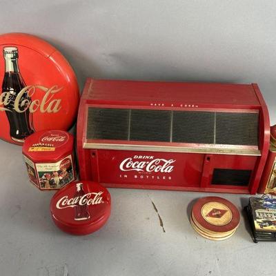 Lot 314 | Vintage Coca- Cola Phone, Tins, Coasters, & More
