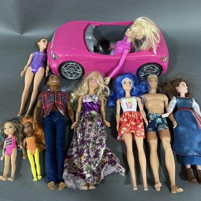 Lot 51 | Barbie Dolls, Ken Dolls & Toy Car.
