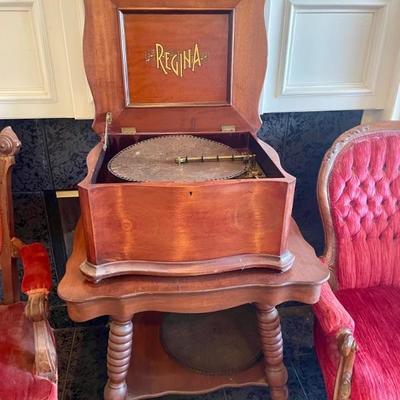 Sale Photo Thumbnail #21: Working antique Regina metal disc music box with many metal music discs. 