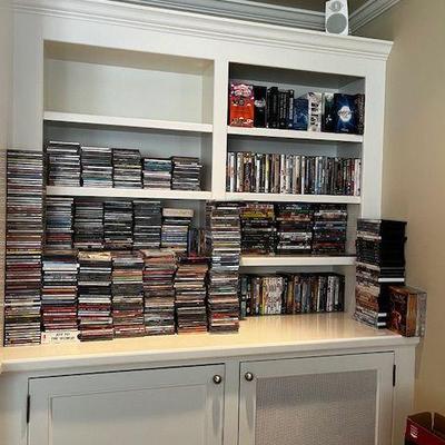 hundreds of DVD & CD's all in cases