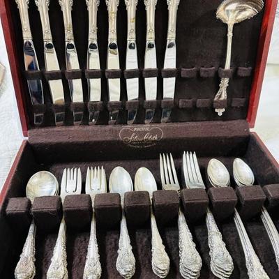 Sterling silver. Gorgeous pattern. And take a look at those wonderful cake forks! 