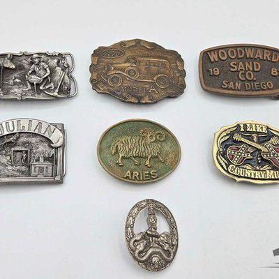 #1906 • (6) Belt Buckles & (1) Pin
