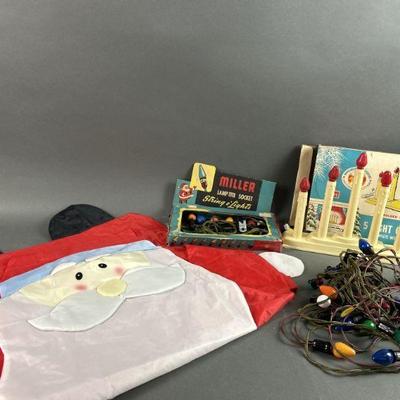 Lot 593 | MCM Holiday Lights & 40x25in Santa Flag
