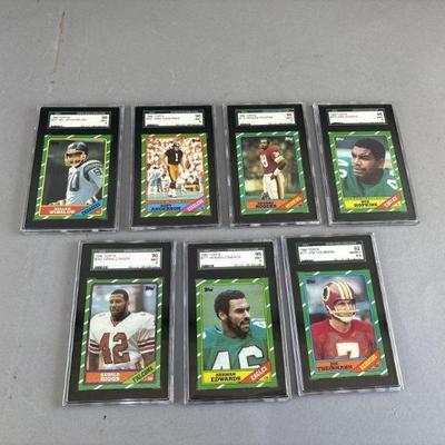 Lot 143 | 7 1986 Topps Mint Graded Football Cards
