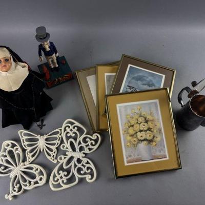 Lot 570 | Framed Pictures, Nun Doll, and More
