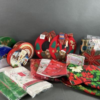 Lot 654 | Vtg. Holiday Tins, Fabric/Paper Tablecloths & More
