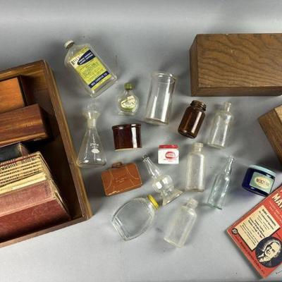 Lot 580 | Vintage Glass, Books, and Boxes
