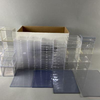 Lot 241 | Clear Plastic Cases For Cards & Baseballs
