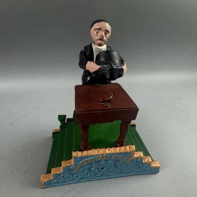 Lot 307 | Vintage Magician Cast Iron Bank
