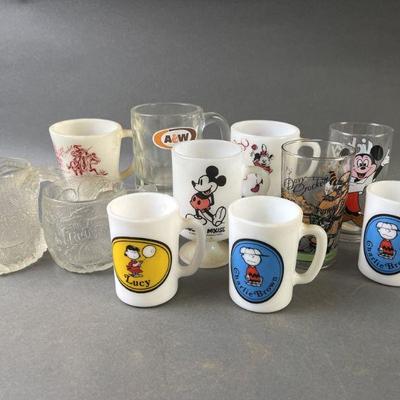 Lot 595 | Mickey Mouse, Peanuts, Flintstones Mugs & More
