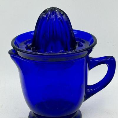 https://ctbids.com/estate-sale/31612/item/3566526/Summit-Art-Glass-Cobalt-Glass-Pitcher-Juice-Reamer