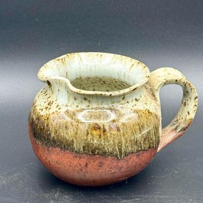 Signed Ceramic Creamer Pitcher
https://ctbids.com/estate-sale/31612/item/3566211/Signed-Ceramic-Creamer-Pitcher