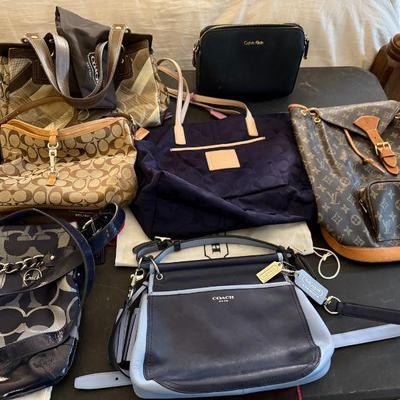 DESIGNER
BLACK & BLUE COACH SOLD