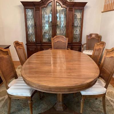 Louis XVI style oval dining table with 6 matching cane backed chairs