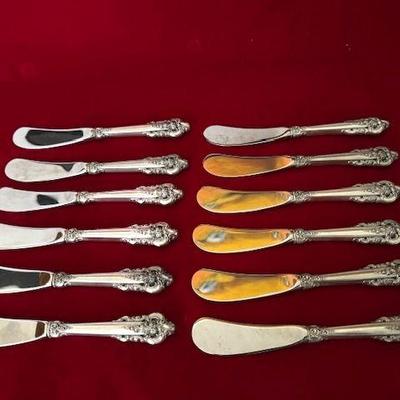 Set of 12 butter spreaders in the Grande Baroque pattern, by Wallace Silversmiths