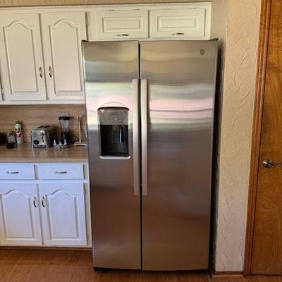Stainless steel refrigerator, less than 2 years old.