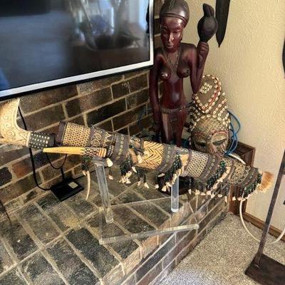 Mandau stule Indonesian  Borneo d@gger with scabbard,  Chokwe tribe pwo-style mask with female face,  carved statue