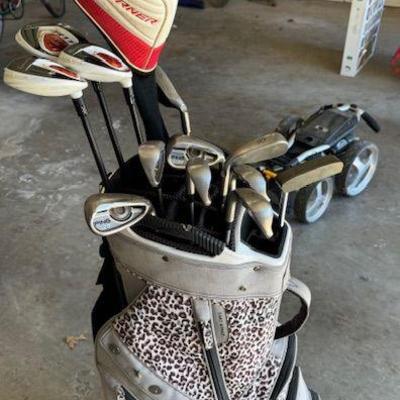 One of several bags of golf clubs - this set is Ping and TaylorMade