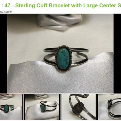 Lot # : 47 - Sterling Cuff Bracelet with Large Center Stone
Handmade with a makers mark. Marked sterling and has a combined weight of...