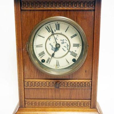 1090	ANTIQUE SETH THOMAS SHELF CLOCK IN WALNUT CASE W/DROP CENTER DOOR & ORIGINAL LABEL, APPROXIMATELY 5 IN X 11 IN X 16 IN HIGH
