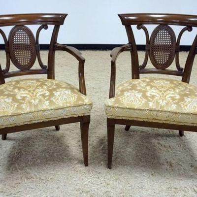 Sale Photo Thumbnail #143: 1143	PAIR OF WALNUT UPHOLSTERED ARMCHAIRS W/CANED MEDALION BACK CENTERS
