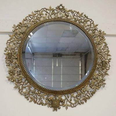 1148	ROUND BEVELED EDGE MIRROR IN ORNATE WREATH LIKE CAST BRASS FRAME W/SCONCE HOLDERS
