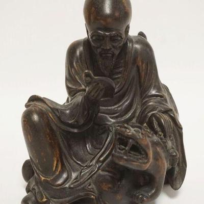 1013	ASIAN WOOD CARVING OF A MAN READING & PETTING A TIGER, APPROXIMATELY 8 IN HIGH
