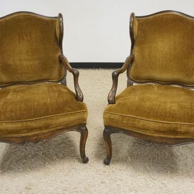 1144	PAIR OF FRENCH PROVINCIAL WALNUT UPHOLSTERED WING BACK CHAIRS
