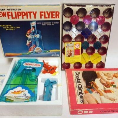 1249	2 VINTAGE BOXED TOYS, CRYSTAL CLIMBER AND FLIPPITY FLYER
