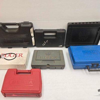 #3460 • (6) Gun Cases, (1) Ruger Box & (1) Gun Lock with Keys
