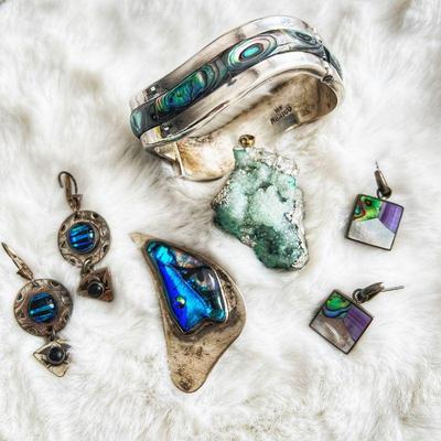 Unique collection with abalone shell, and aqua druzy and dichroic glass accents.
