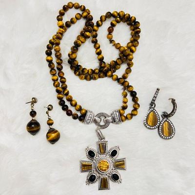 Gorgeous Judith Ripka Sterling Silver jewelry set, which includes a tiger eye bead necklace with a decorative silver clasp, a matching...