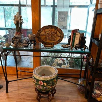 Thick glass top and heavy iron console table. 