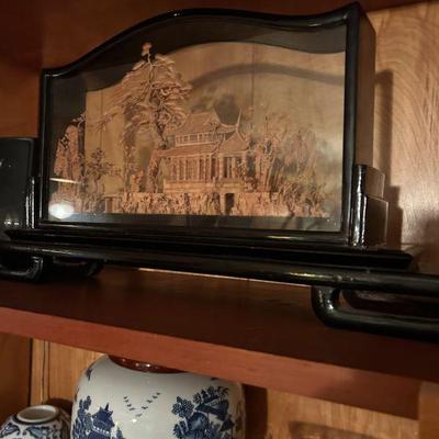 Intricate Japanese wood carving in glass. 