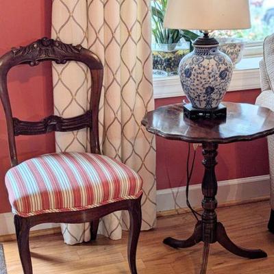 Victorian ladies chair with tea table and blue and white ginger jar style lamp