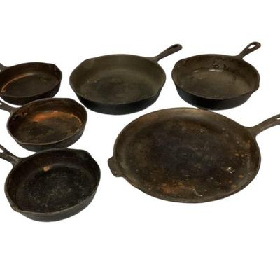 LUGR546 Antique Wagner Cast Iron Pans	Includes an 11" skillet griddle, two deep-sided saucepans and three 6" pans. Five are...