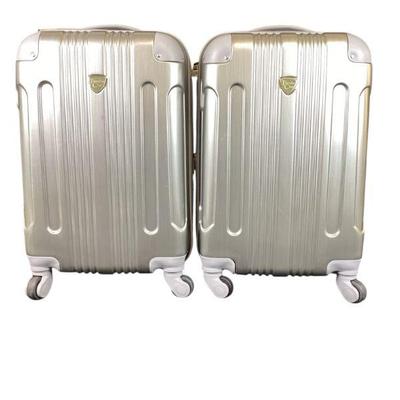ROMO511 Two Travelers Club Carry On Suitcases	Two expandable aluminum-look, roll-aboard suitcases
