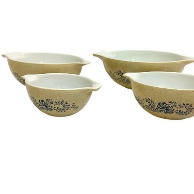 LYZE815 Vintage Pyrex Nesting Bowls.	Four nesting bowls in "homestead" pattern. Largest measures approximately 12.5",...