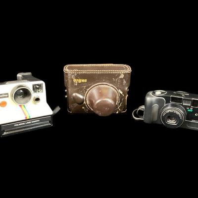 ROMO512 Three Cameras - One Step Polaroid, Argus And Canon Megazoom 76	Three vintage cameras Polaroid model, SX-70, Argus serial...