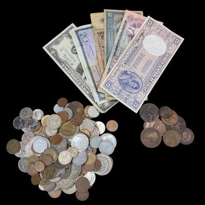 ALSH915 An Assortment Of International Coins And Bills	Various dates and countries. Measures Approximately 6 x 3 inches.
