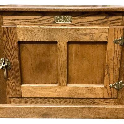 LYZE210 White Clad Ice Box End Table	Made out of oak wood. Has two shelves inside. Does have a little cut hole in the back. 
