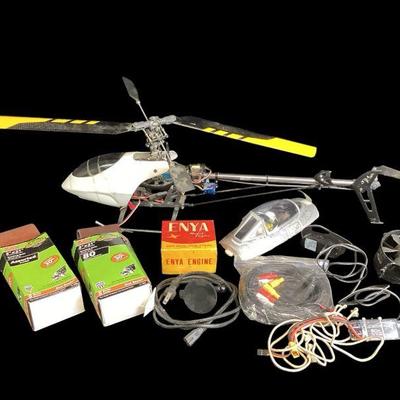 ROMO562 Model Helicopter And Miscellaneous Parts	Model helicopter(for parts) rolls of sandpaper, small box of engine parts, electrical...