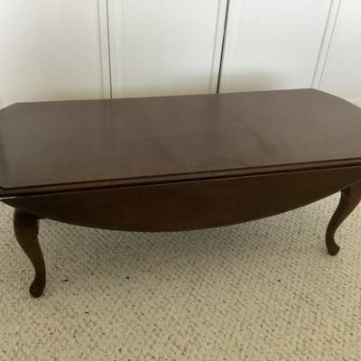 $75 drop  leaf coffee table 15"H 46"L 17"to 30"W with leaves up
