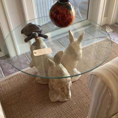 $128- round glass top accent table with bunny base 19"H 30"diameter-As is