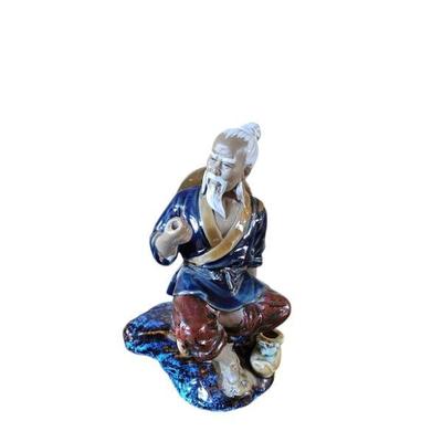 Old fisherman figurine
