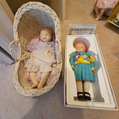 Baby doll and wicker cradle