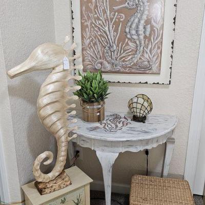 Seahorse statue, Demilune table and art with seahorse motif
